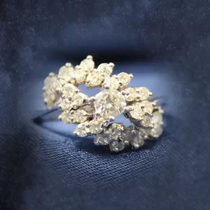 two offset east-west arcs of round diamonds around a round center diamond