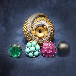 heavy pinkie size cocktail ring with a swirl of diamonds and interchangeable center ornament: emerald, rubies, turquoise, pearl