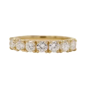 7 round diamonds in a yellow gold band