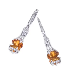 dangle post earring with two large orange stones facing each other; stones are citrine and palmeira