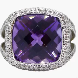 ring with large cushion cut amethyst surround by a halo of diamonds