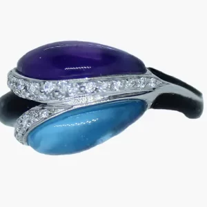 ring with back to back single amethyst and blue topaz each surrounded by a diamond halo with black enamel on the shank