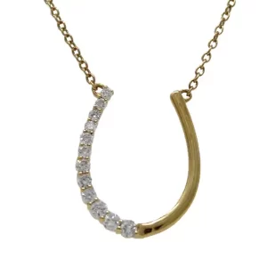 yellow gold in a horseshoe shape with 12 diamonds on half of the horseshoe and plain yellow gold on the other half