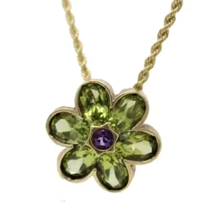 flower shaped gold pendant with 6 oval peridot petals and a center round amethyst