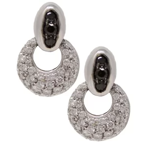post earrings with an oval of black diamonds holding a dropped flattened sphere of diamonds with a circular cutout