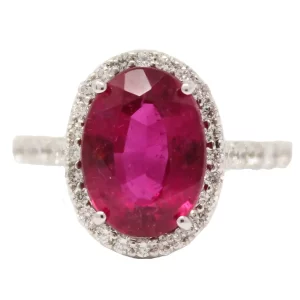 large oval rubellite (red tourmaline) surrounded by a halo of round diamonds