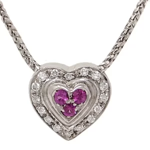 three round pink sapphires surrounded round diamonds in a heart-shaped necklace