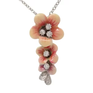 three pink enamel and diamond flowers pendant