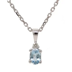 oval aquamarine pendant with a tiny diamond at the bottom of the bail
