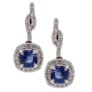 round sapphires in an illusion setting to looking like a cushion cut surrounded by a halo of tiny round diamonds