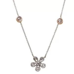 white gold diamond flower with 2 diamonds bezel set in rose gold
