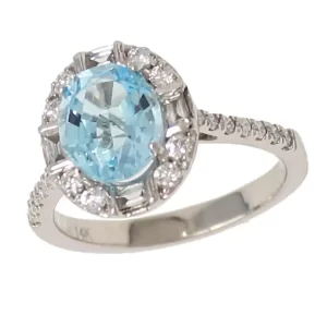 oval aquamarine in cathedral setting surround by a halo of round diamonds and accented with diamonds on the arches and shoulders