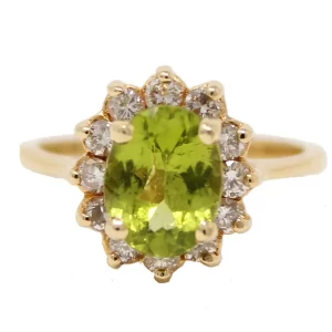 ring with an oval peridot surround by a halo of round diamonds