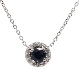 round sapphire with halo of round diamonds attached to a chain
