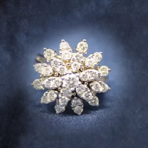 49 round diamonds stacked in 3 layers resembling a multi-leafed flower.