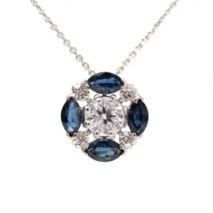 Round pendant with a center round diamond and 4 marquis sapphires alternating with 4 round diamond