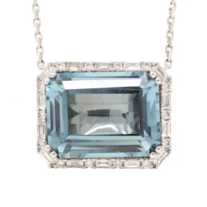 east/west step cut london blue topaz surrounded by a halo of round diamonds
